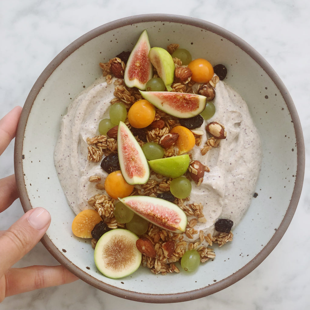 YOGURT BOWL WITH GRANOLA, FIGS AND POMEGRANATE SEEDS