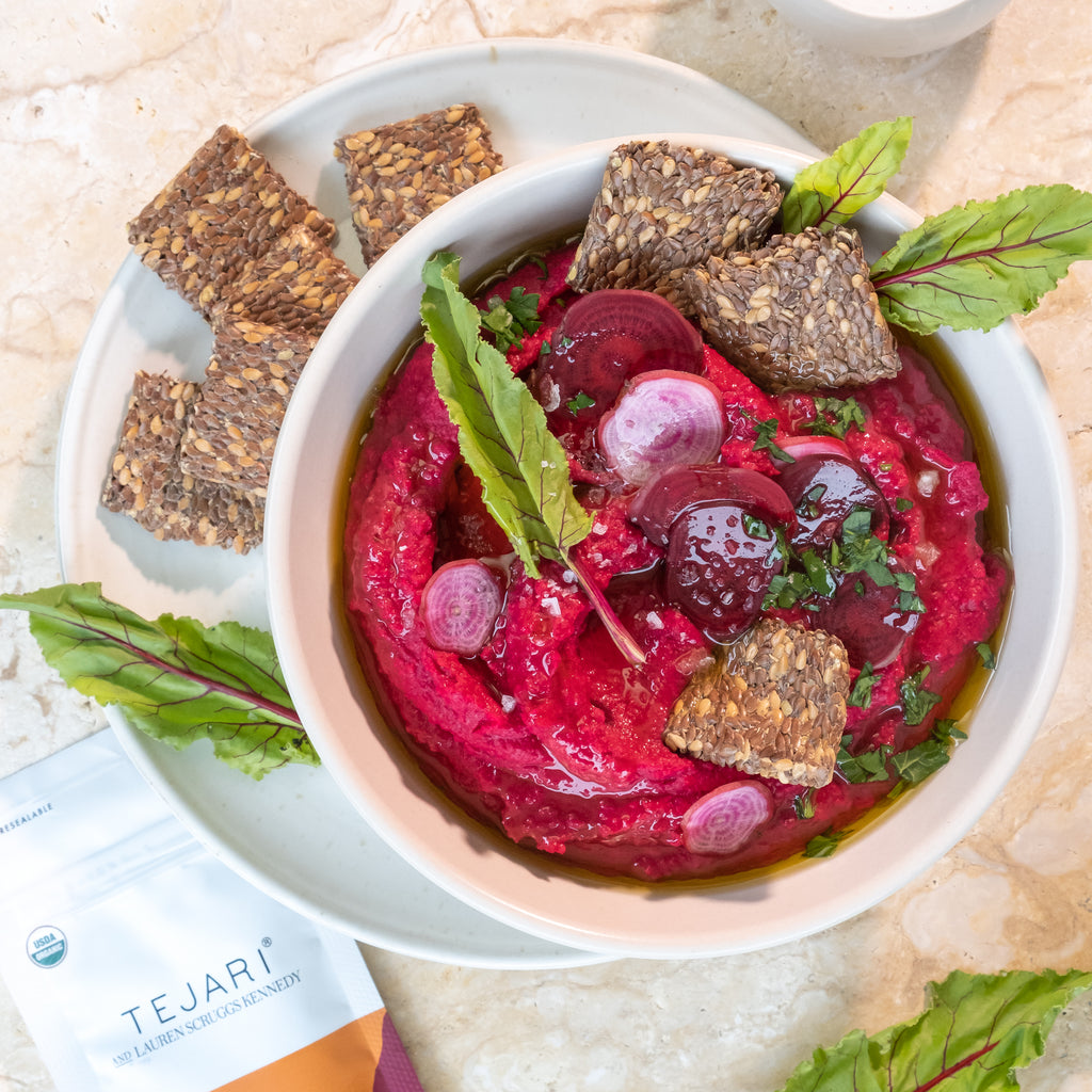 top view of beetroot hummus recipe in white bowl
