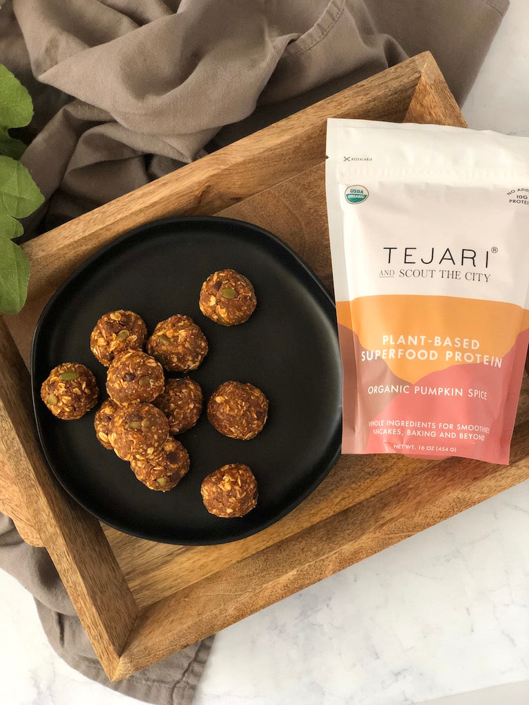one plate of pumpkin energy balls with bag of pumpkin spice blend protein powder by Tejari