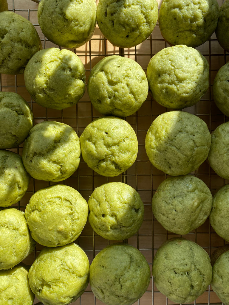 top view of spinach blueberry muffins on wire rack