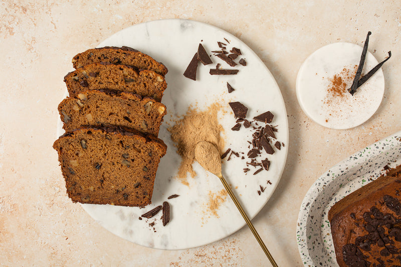 top view of three slices of cacao nibs bread recipe on white plate