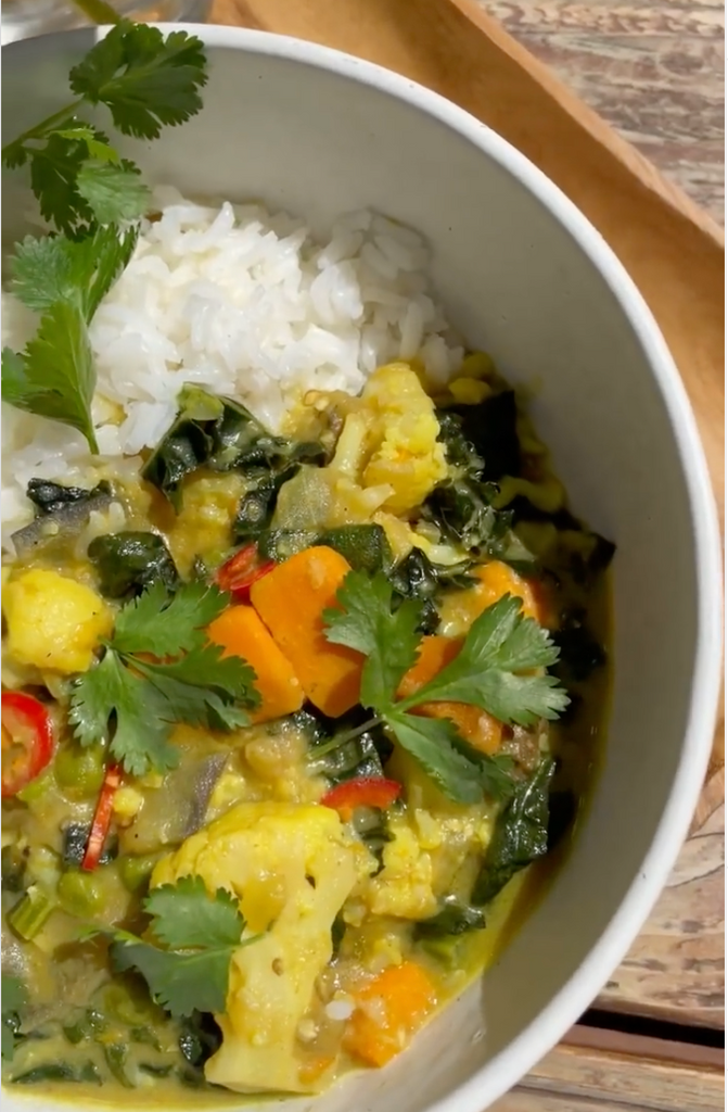 top view of vegan curry recipe in bowl with veggies