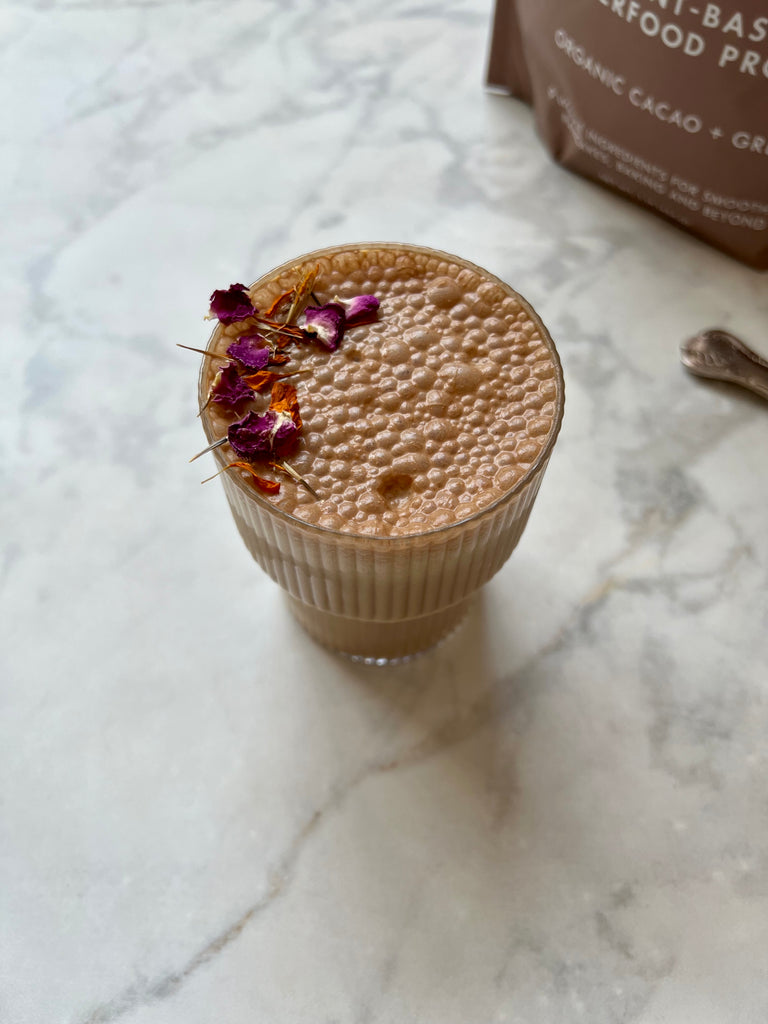 Organic Cacao Plant-Based Superfood Smoothie in a Glass on a Kitchen Counter
