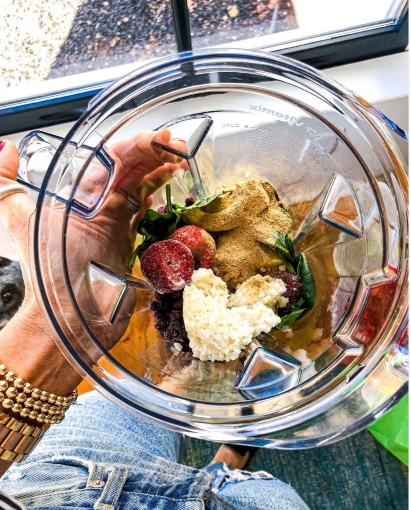 Mixed Fruits and Vegetables with Turmeric Powder Inside a Blender Jar Not Blended Yet