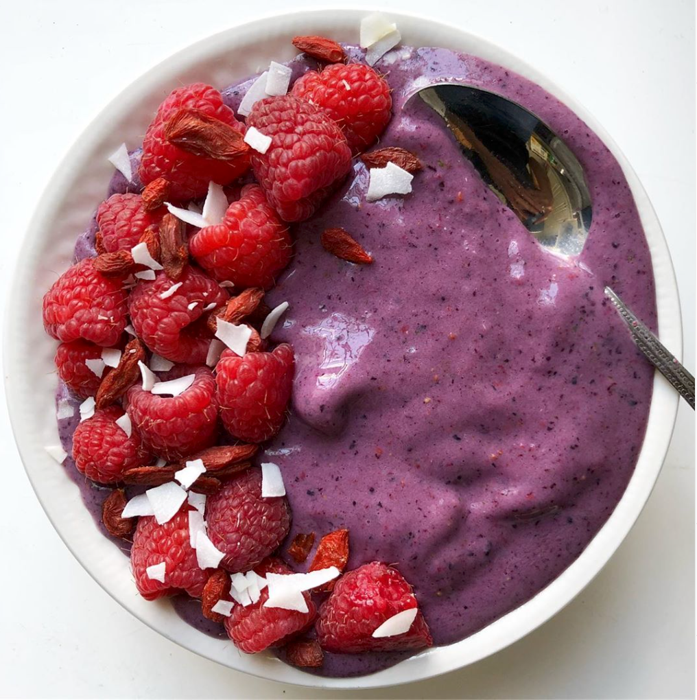 Blueberry plus spinach Smoothie with Raspberries Served in a Bowl 