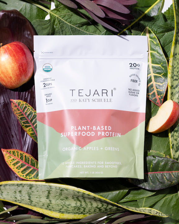 Large Sachet of Plant-Based Superfood Protein Organic Apples and Green on a Garden Leaf's Whole and Sliced Apples