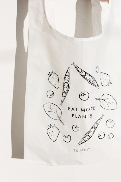 A White Bag Labeled with Eat More Plants
